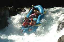 A group of people are rafting down a river.