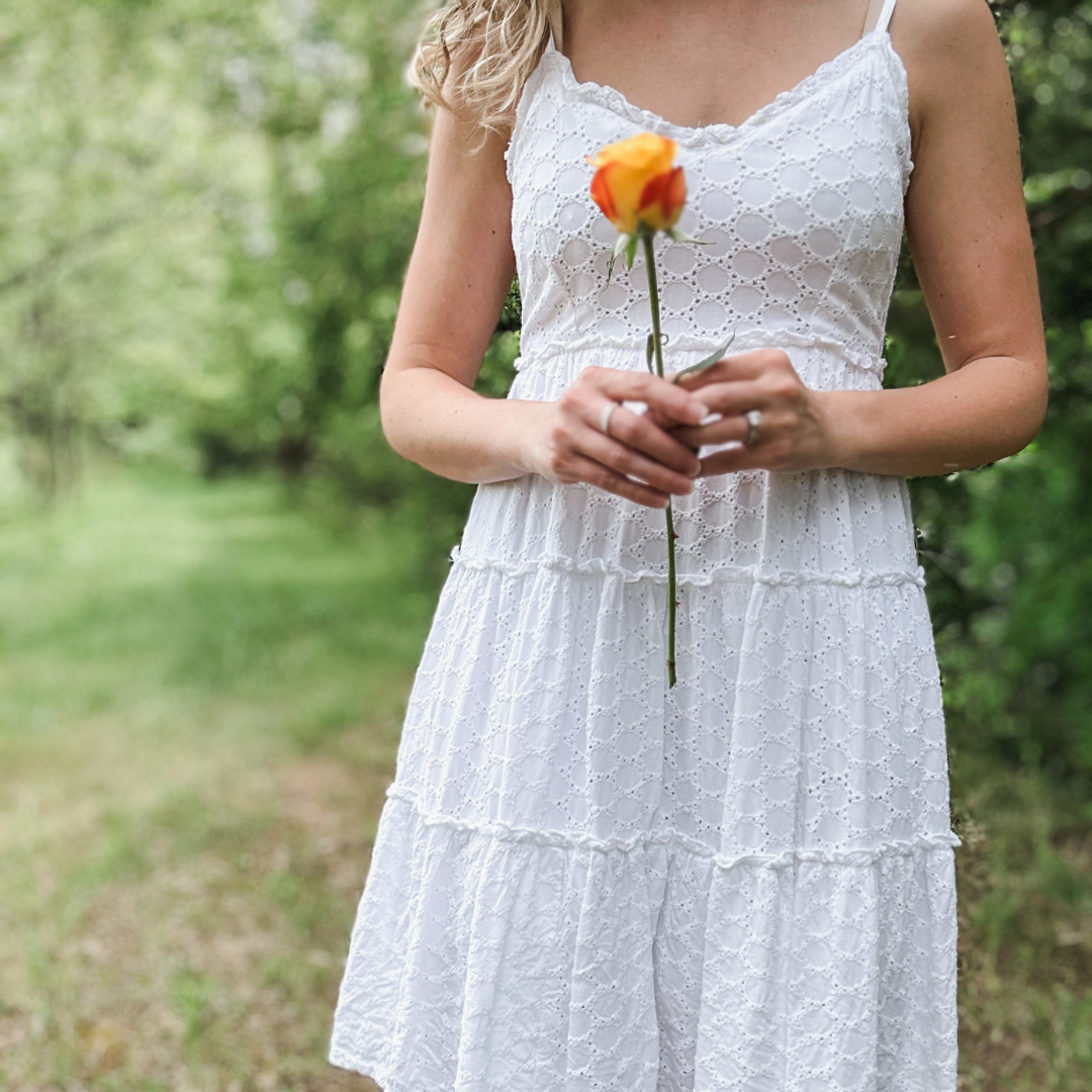woman in a white dress holding a two-tone rose, Bible truths for the in-between season