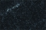 A close up of a black surface with white spots on it