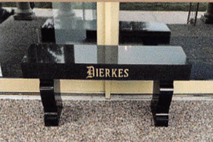 A black granite bench with the name bierkes on it