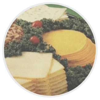 A circle filled with slices of cheese and vegetables