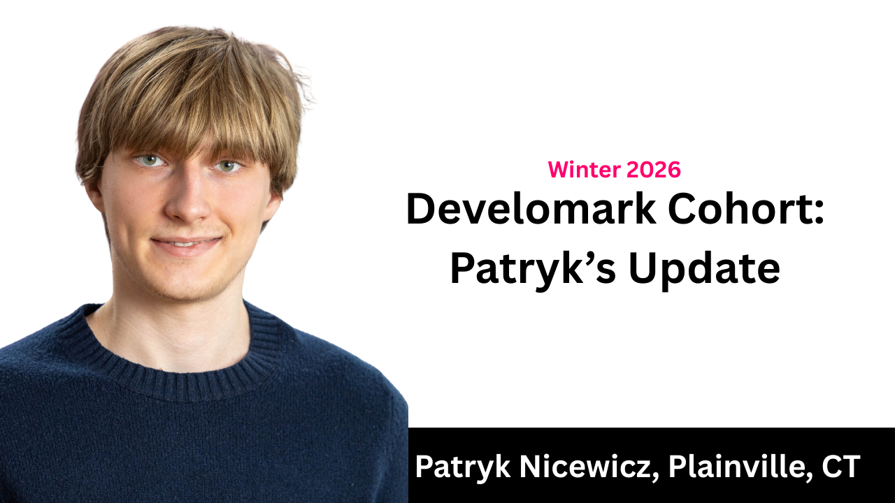 Dim room with a spotlight shining on the floor. Walls are dark, furniture silhouetted in the shadows.