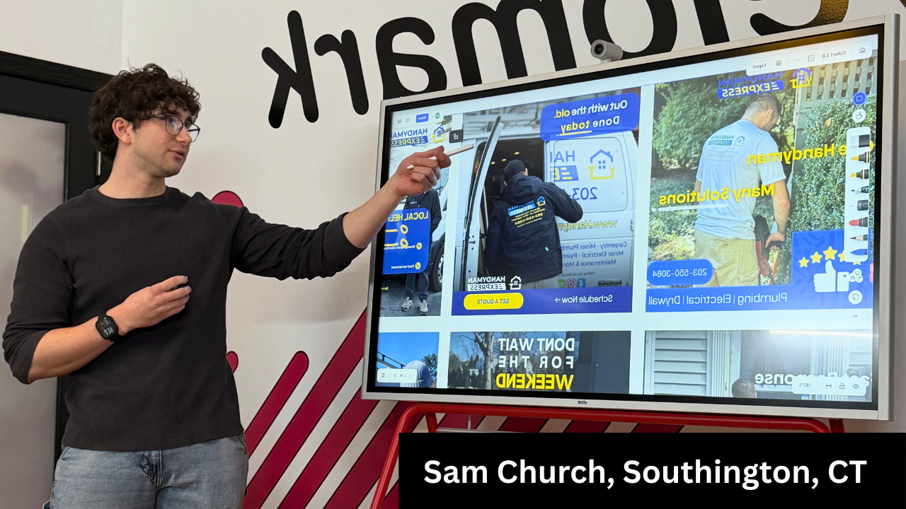 Dim room, a spotlight illuminating a circular area on the floor, walls are dark purple.