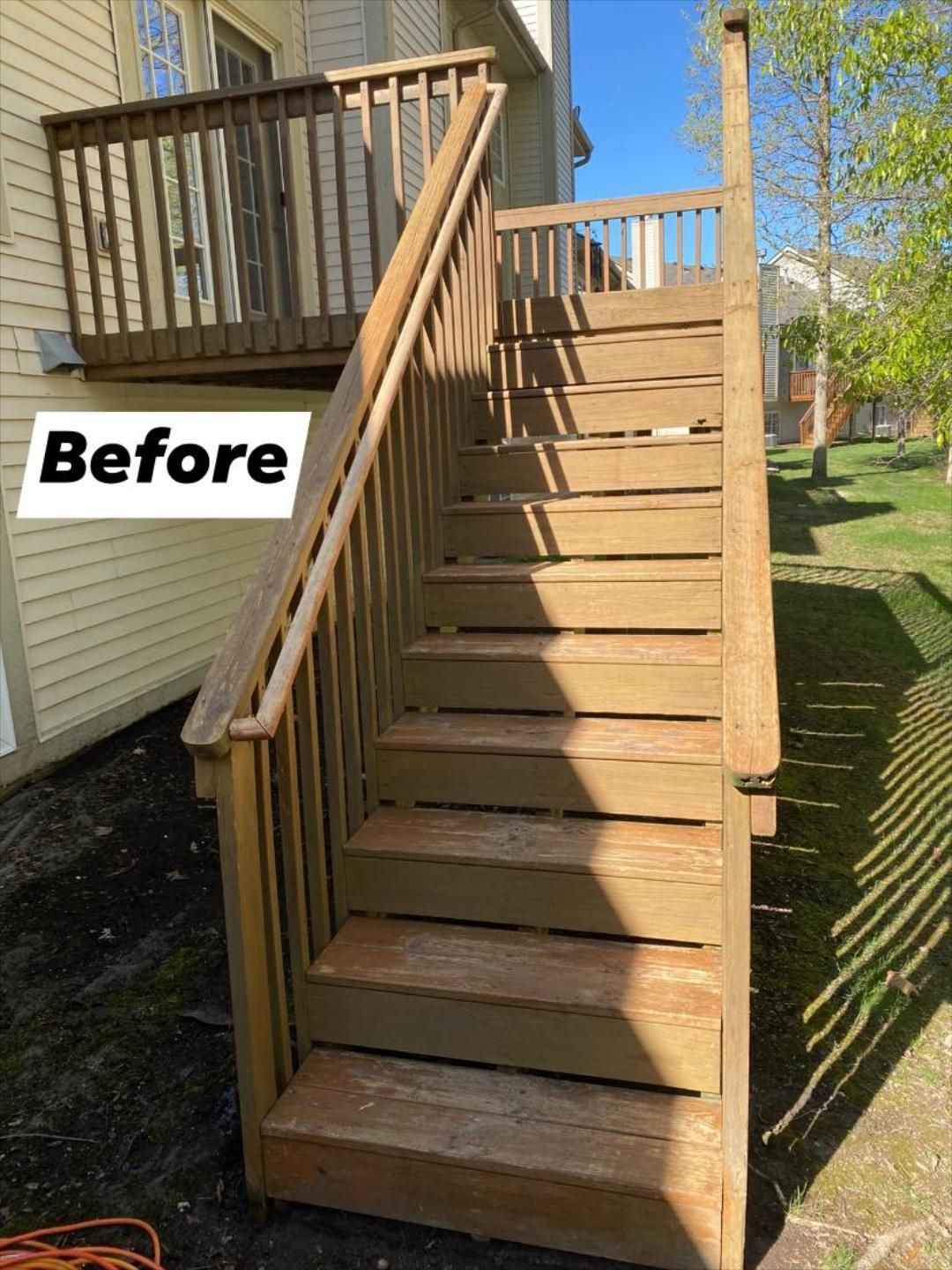 Pressure Pros Soft Washing LLC | before picture of a wooden deck with stairs.