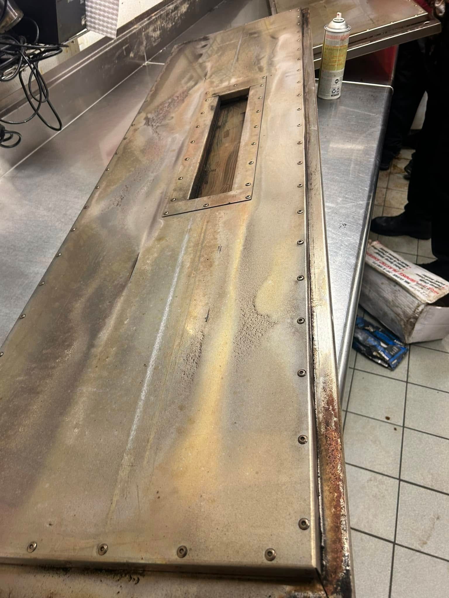 Pressure Pros Soft Washing LLC | concrete driveway with trees in the background.