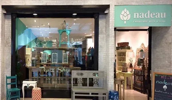 A storefront with a sign that says Nadean on it.