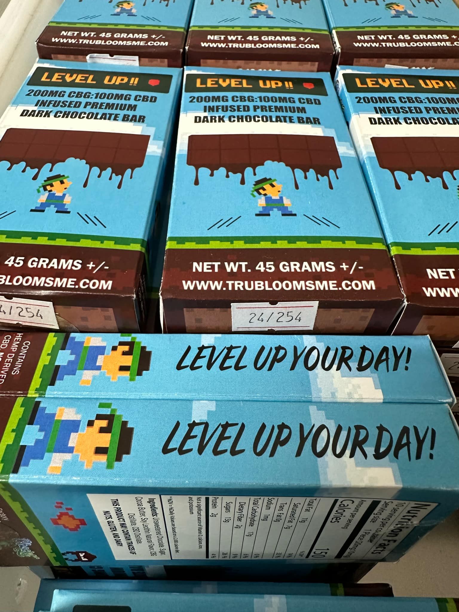 A bunch of clothes are hanging on racks in a store