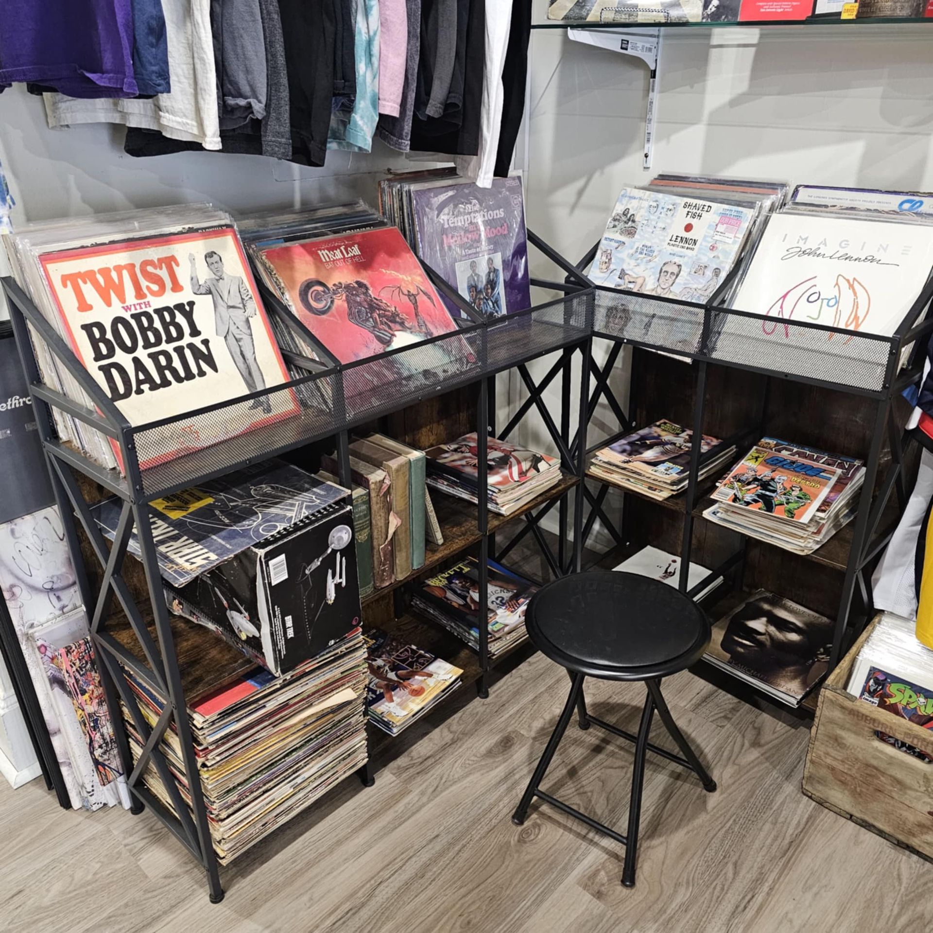 A shelf filled with records including twist bobby darin