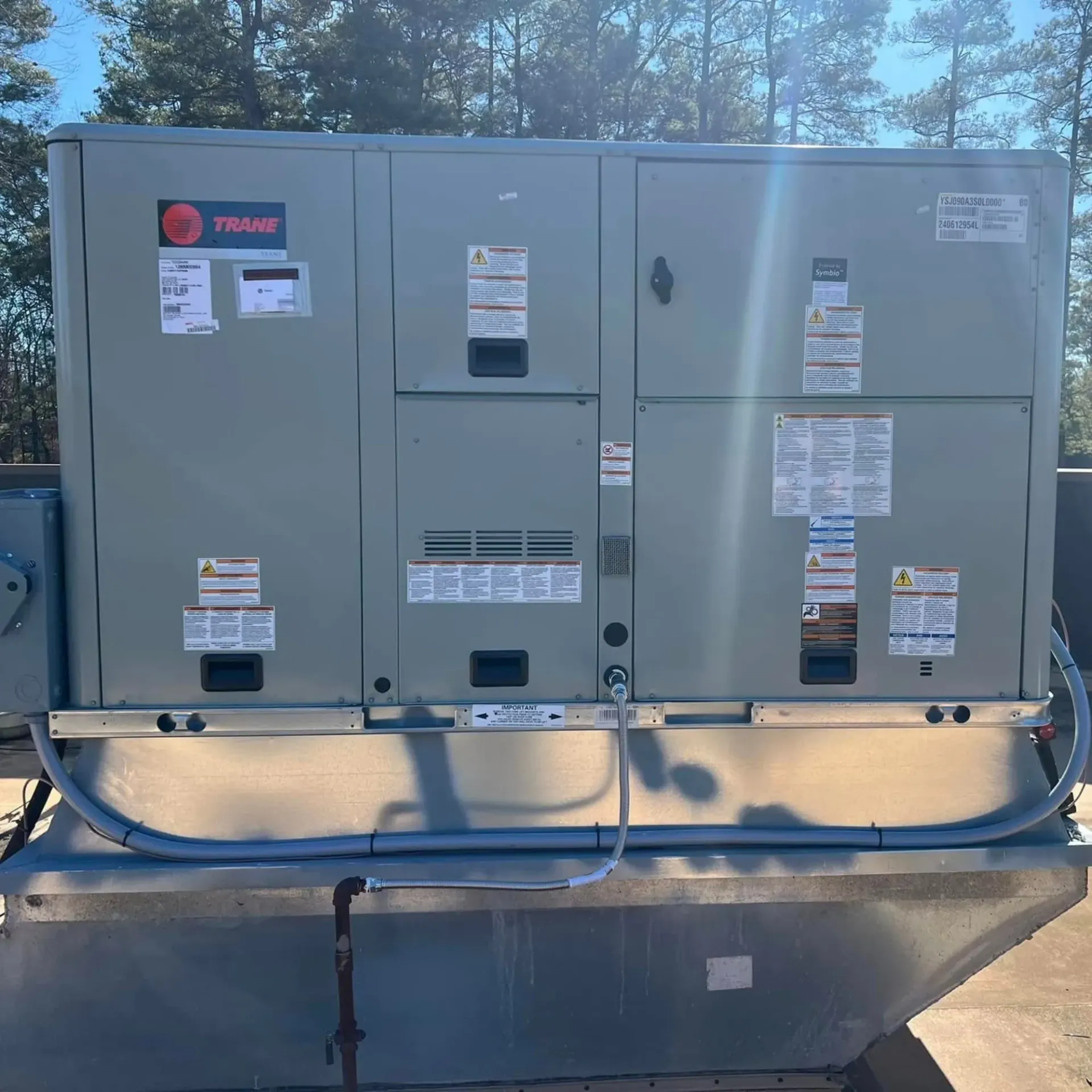 LCS Heating and Cooling - A large gray box with the word trane on it