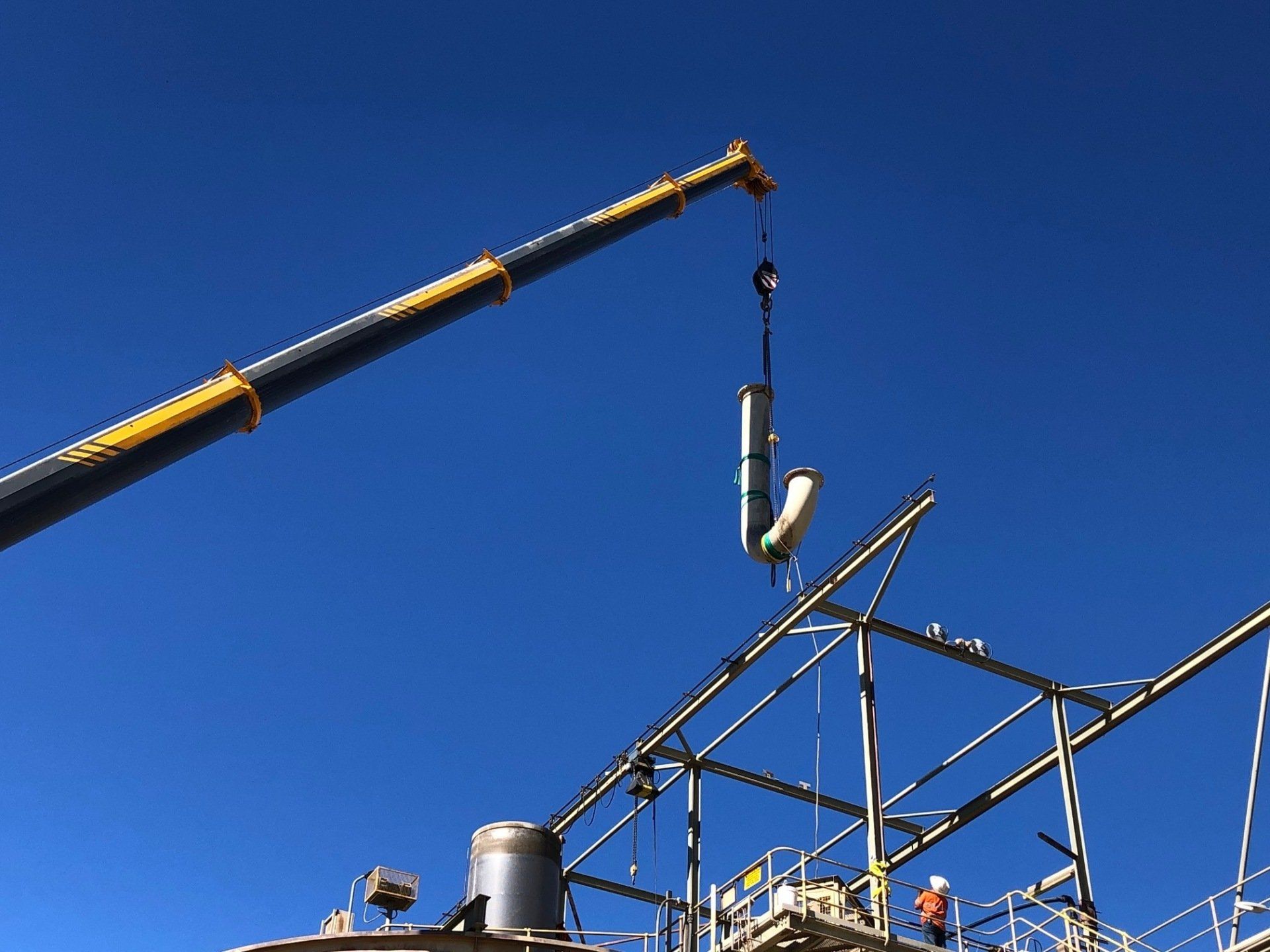 Crane Lifting A Pipe — Labour Hire Specialists In Townsville, QLD