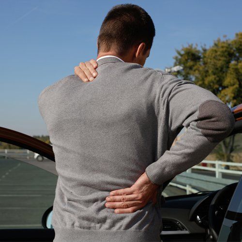 Muscle Pain — Man With Muscle Pains After Long Drive in Concord, CA
