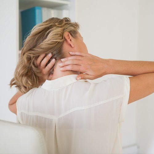 Pain In Neck — Businesswoman Rubbing Her Aching Neck in Concord, CA