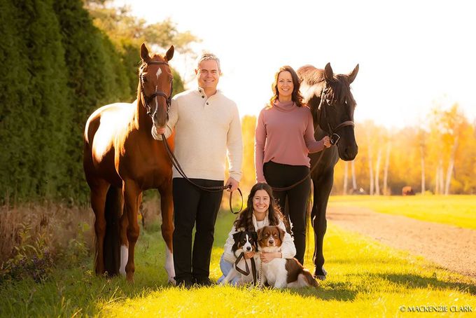 A portrait of Lalonde family with the stable horses