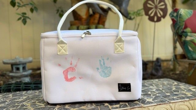 white handprint tote bag Mother’s Day keepsake gift outdoor setting