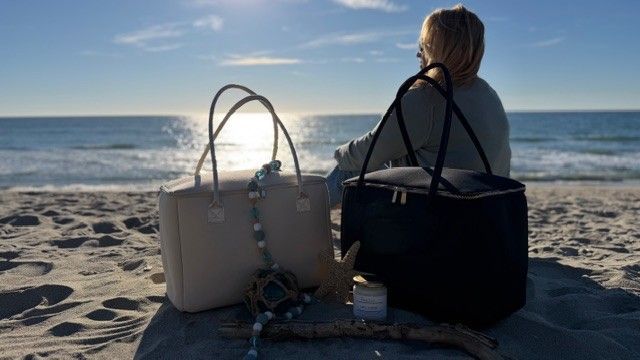 Salt & Stone insulated tote bags by The Stever Co on beach with ocean view