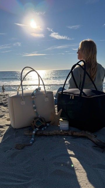Woman carrying Salt & Stone insulated tote bag by The Stever Co at Carlsbad beach