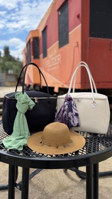 The Stever Co insulated tote bags near vintage train and winery setting