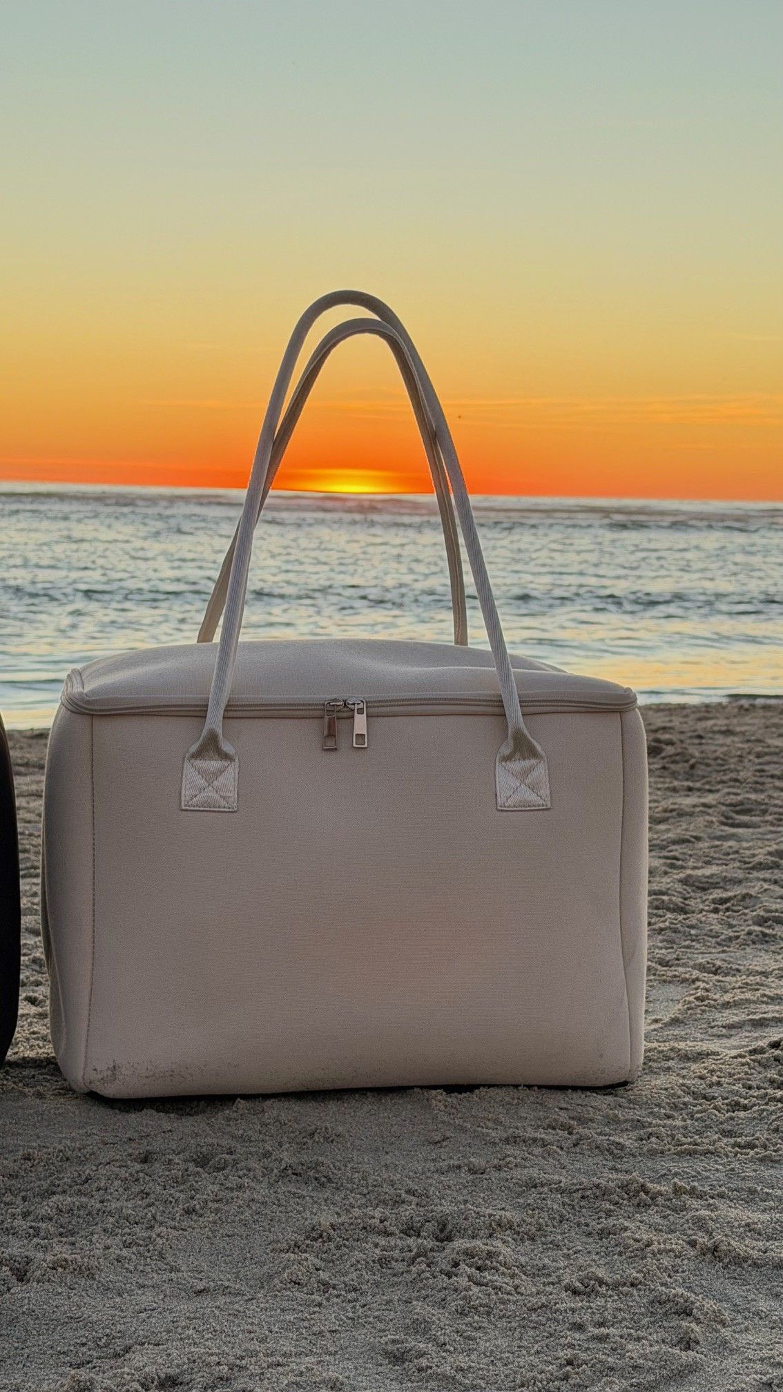 Salt & Stone insulated tote bag by The Stever Co on Del Mar beach  at sunset