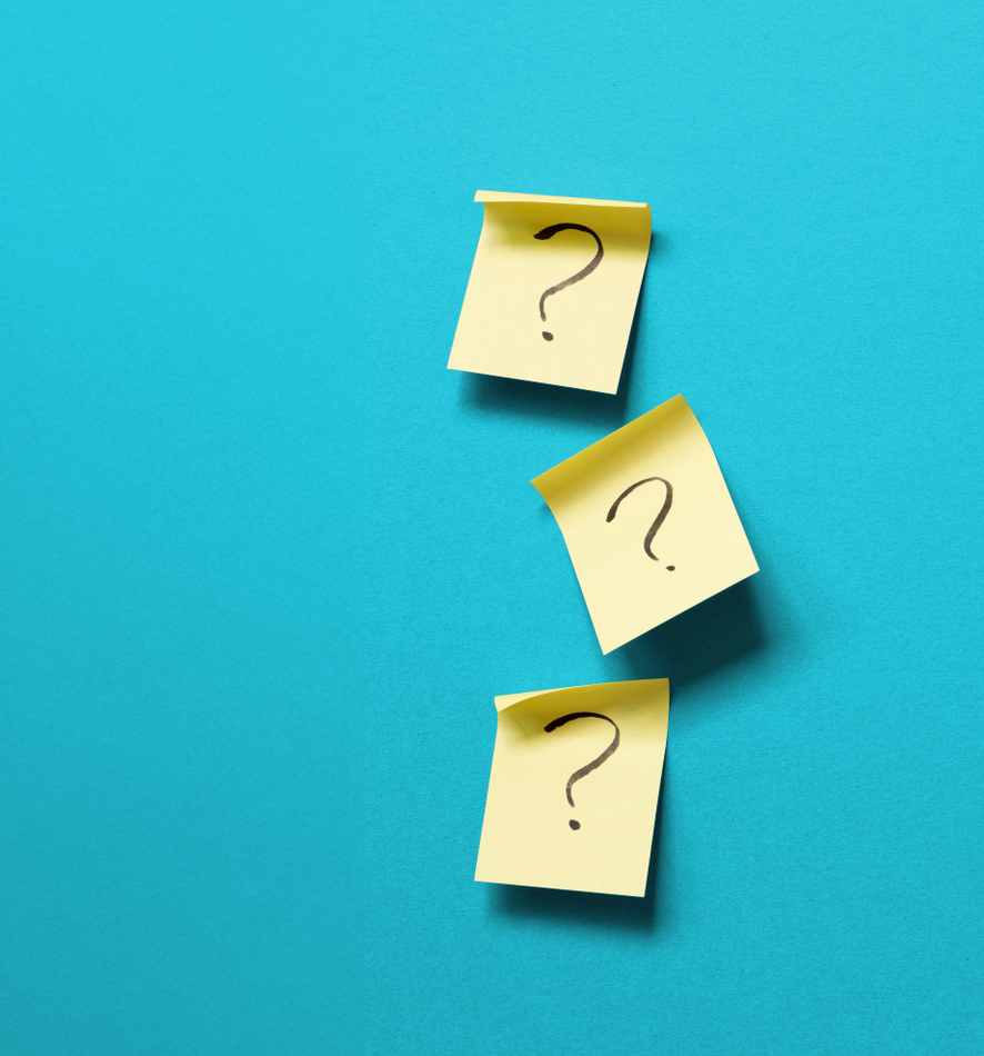Three yellow sticky notes with question marks on them on a blue background