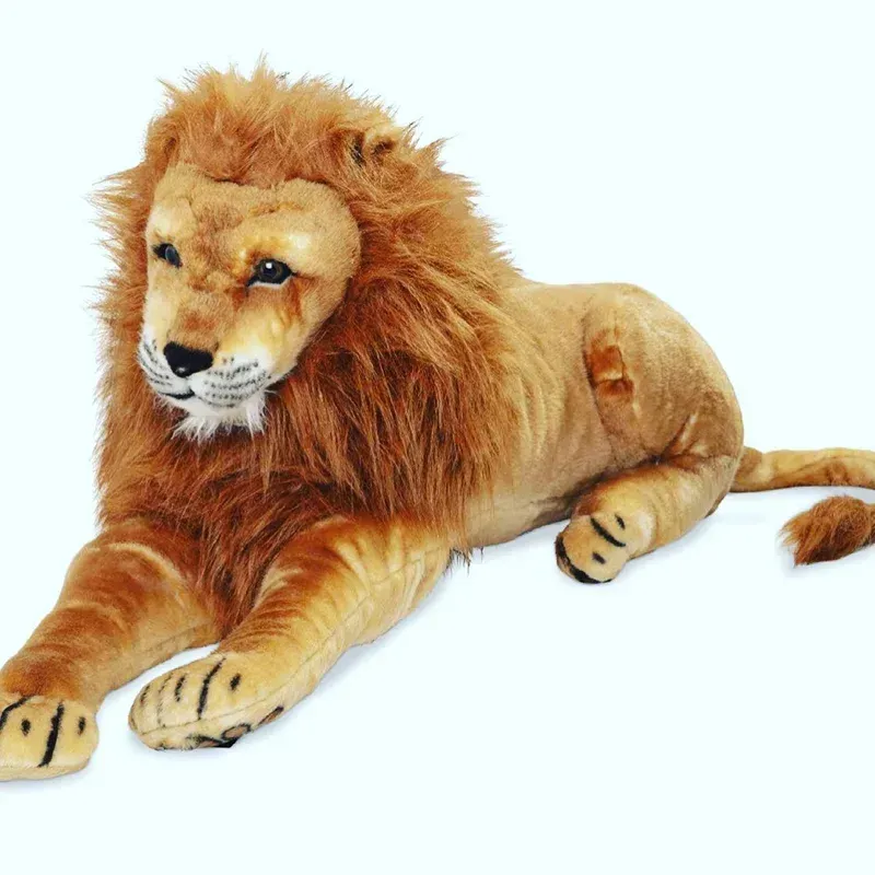 Plush lion toy lying down, tan fur, prominent mane, black paws, and a white background.