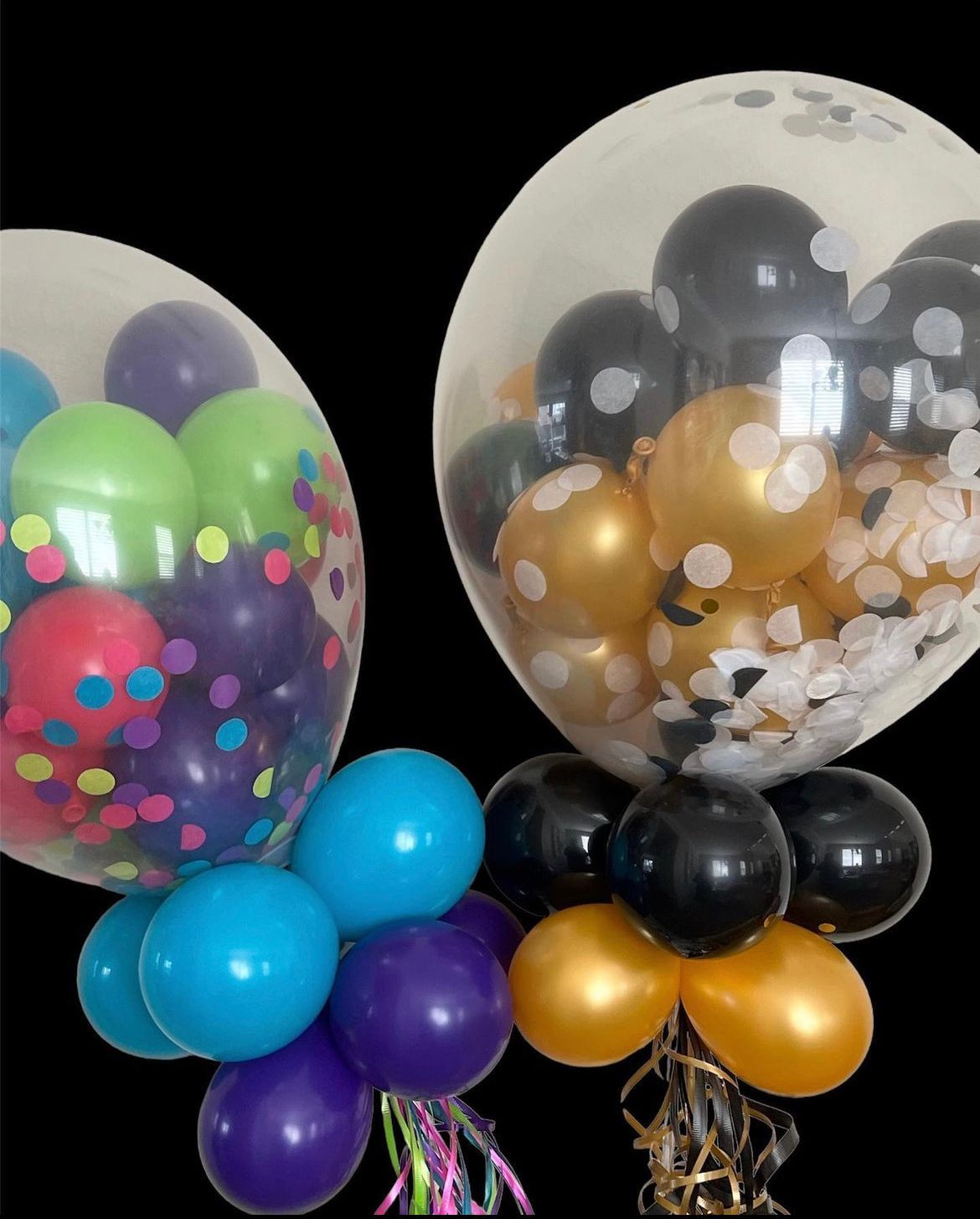 Two colorful balloon bouquets: one with bright balloons inside a clear balloon, the other with black and gold.