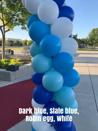 Column of blue and white balloons: dark blue, slate blue, robin egg, and white.