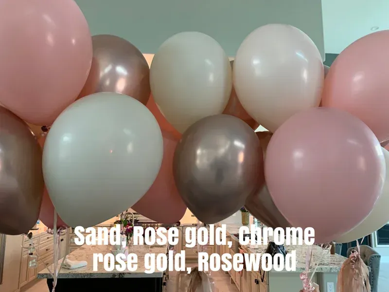 Balloons in rose gold, sand, and white hues, possibly for a party or event.