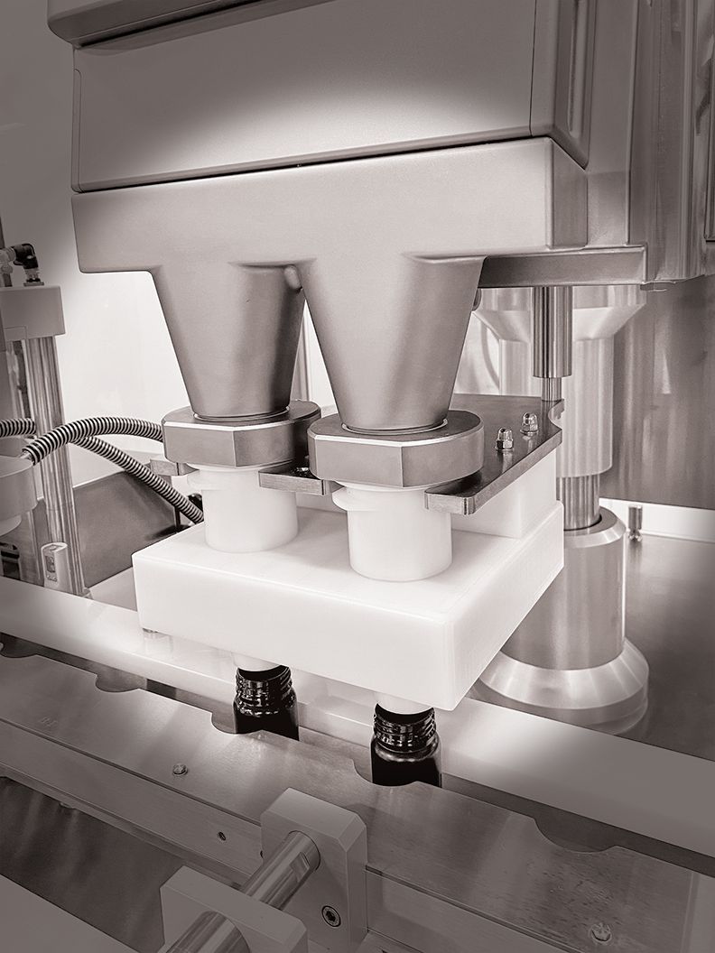 A black and white photo of a machine in a factory