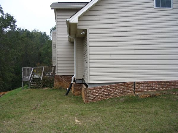 Side Of A House With A Brick Foundation - Oxford, MS - Precision Engineering Corporation