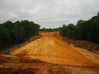 Dirt Road Going Through A Forest On A Cloudy Day - Oxford, MS - Precision Engineering Corporation