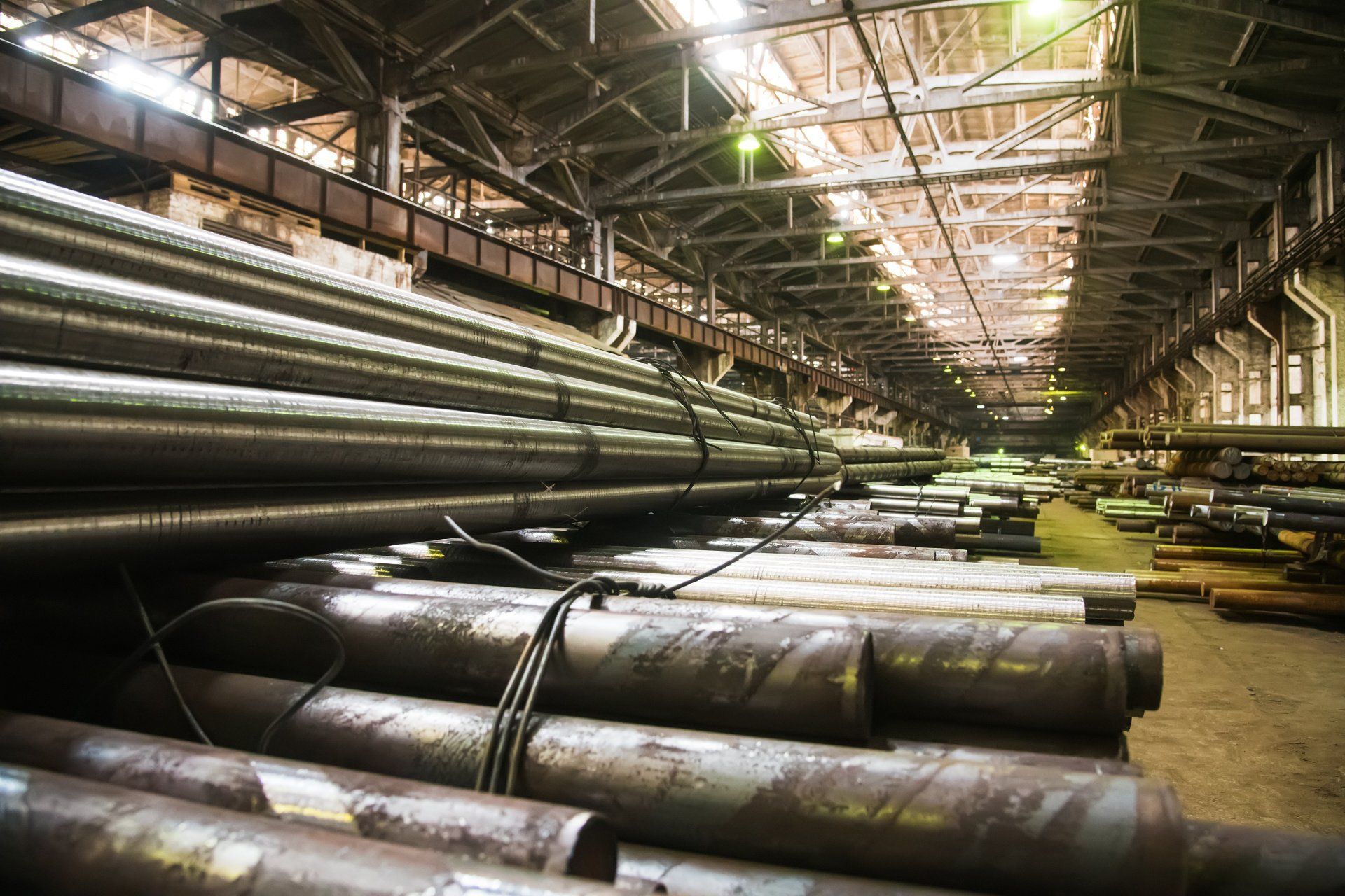 a machine is cutting a piece of metal with sparks coming out of it .