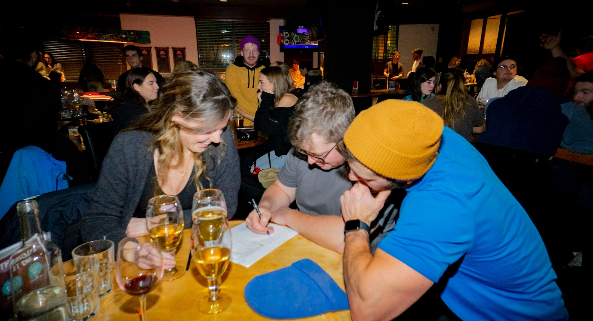 A group of people sitting at a table with epicpete written on the bottom