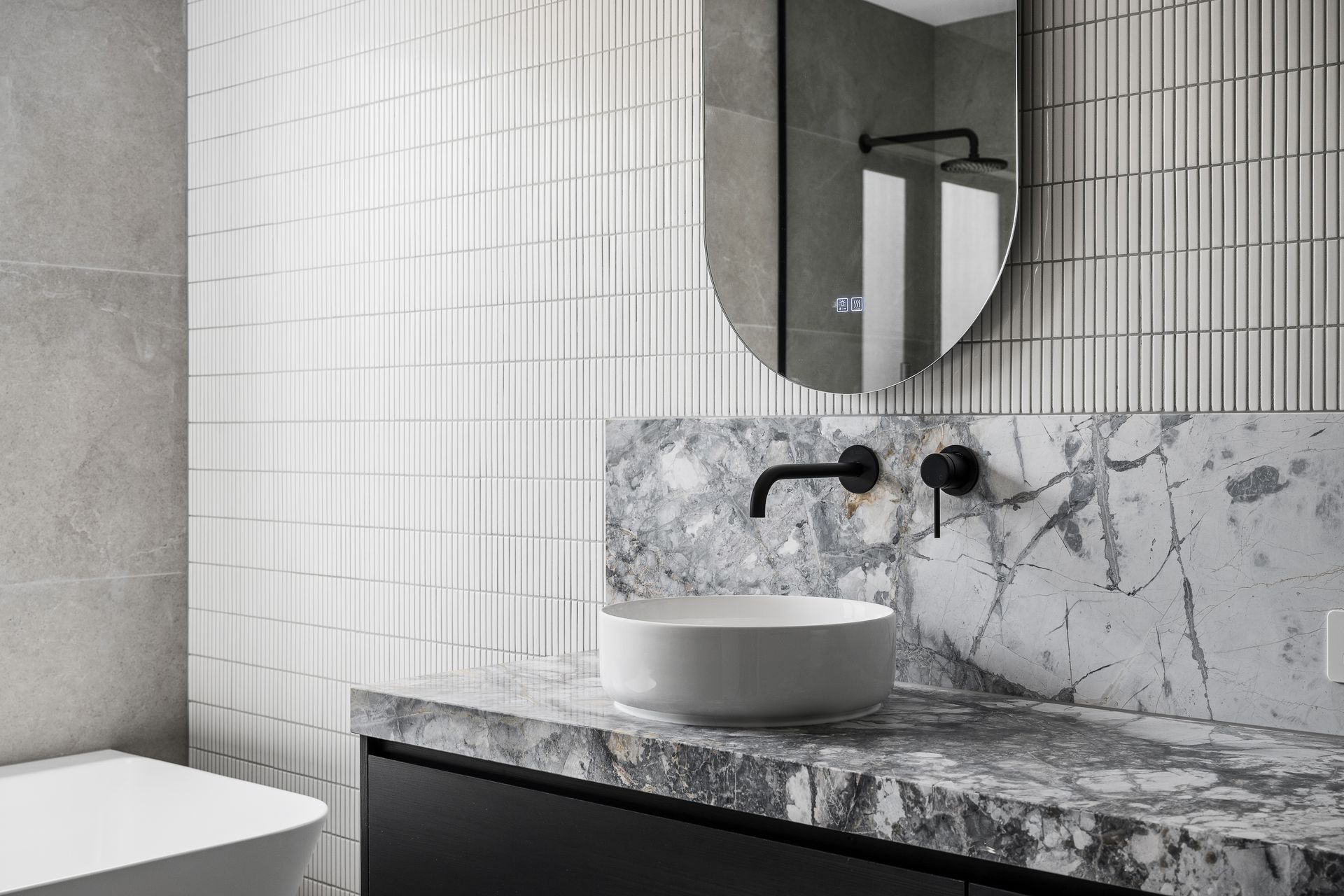 A kitchen with white cabinets , a stove top oven , a sink , and a refrigerator.