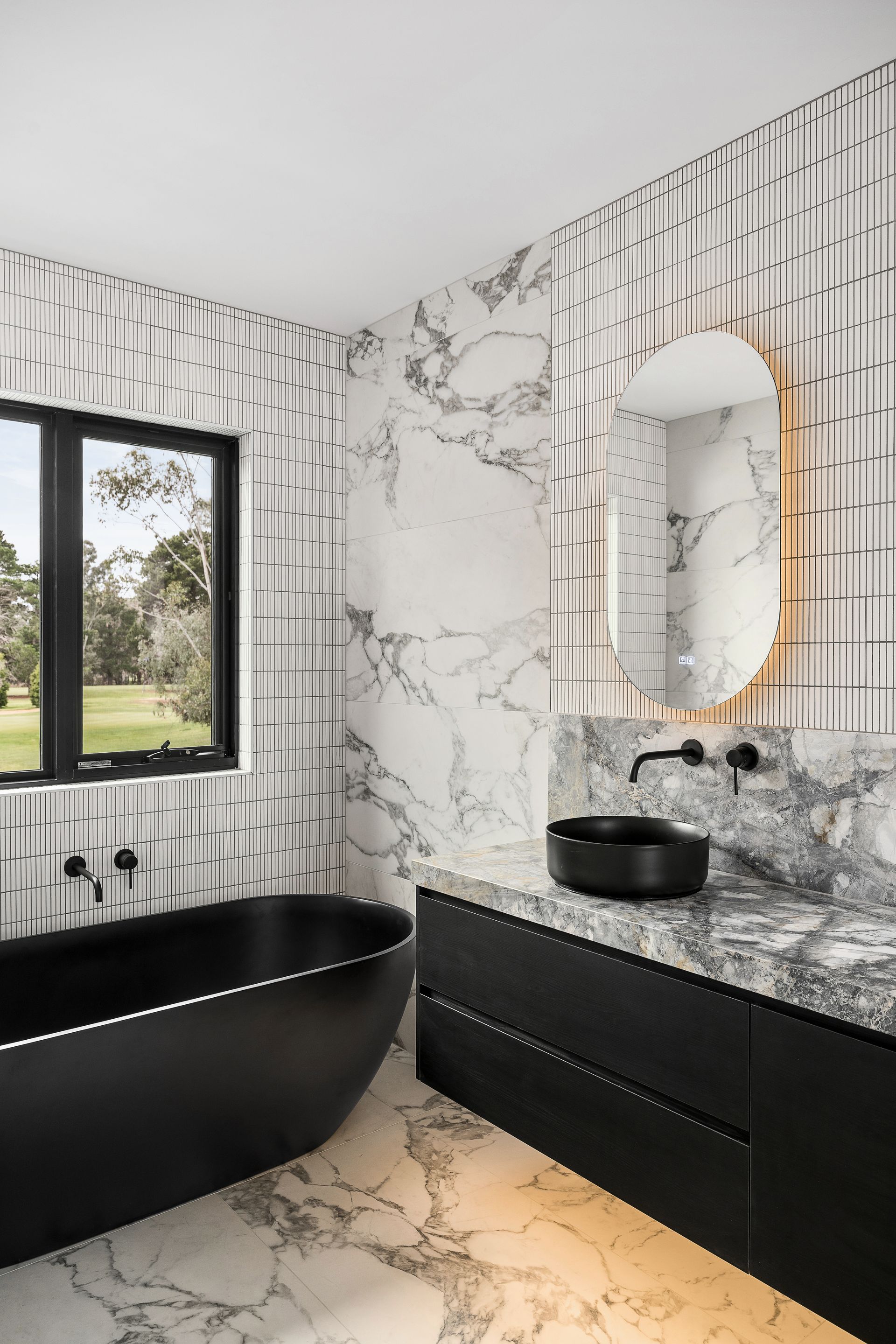 A kitchen with a stove top oven and a sink