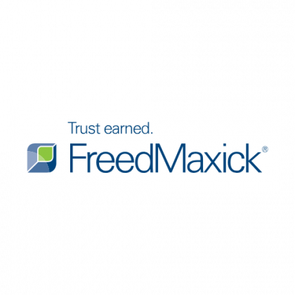 The freedmaxick logo is blue and green and says trust earned.