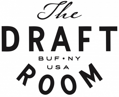 A black and white logo for the draft room in new york