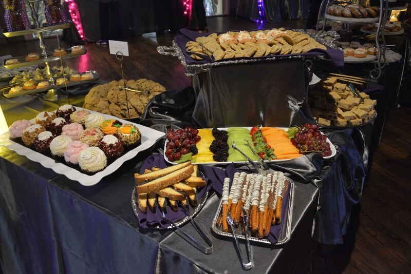 A buffet table with a variety of food on it