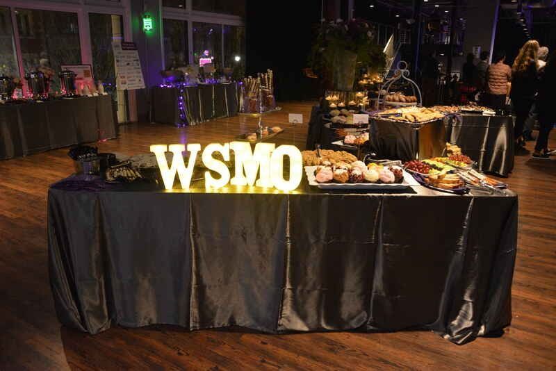 A buffet table with a sign that says wsm on it.