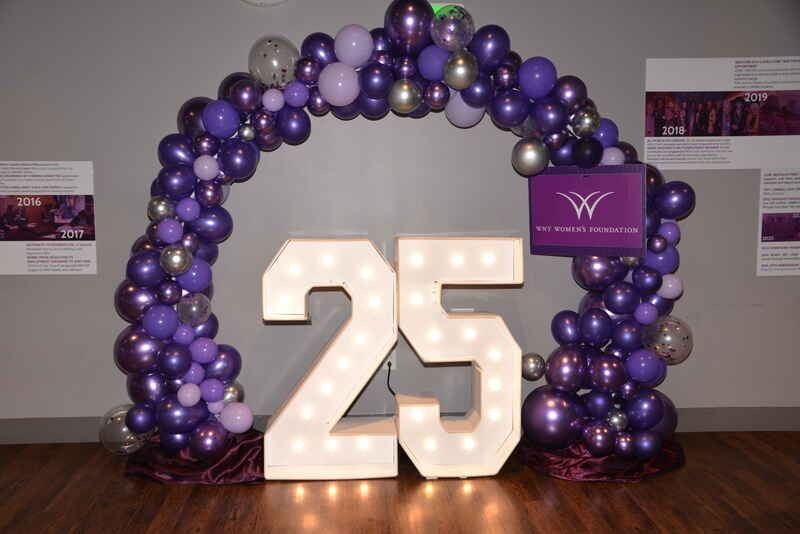 A large number 25 is surrounded by purple balloons.