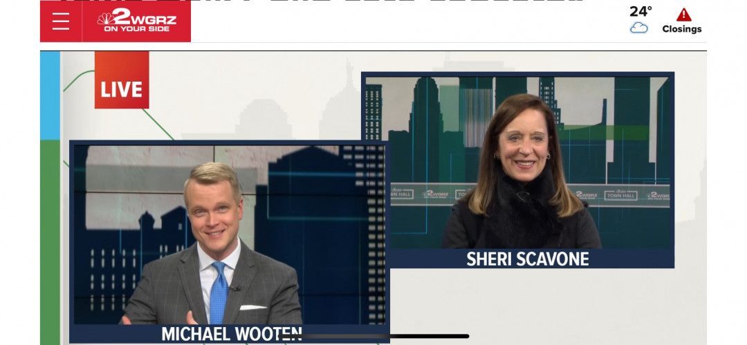A man and a woman are on a live tv show