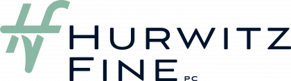 A logo for hurwitz fine pc is shown on a white background.
