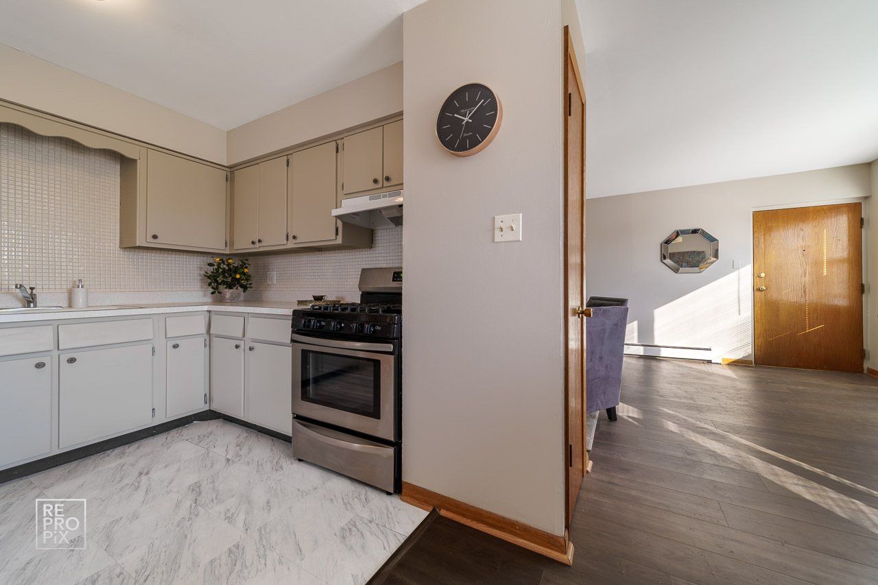kitchen with stainless steel appliances and marble floor