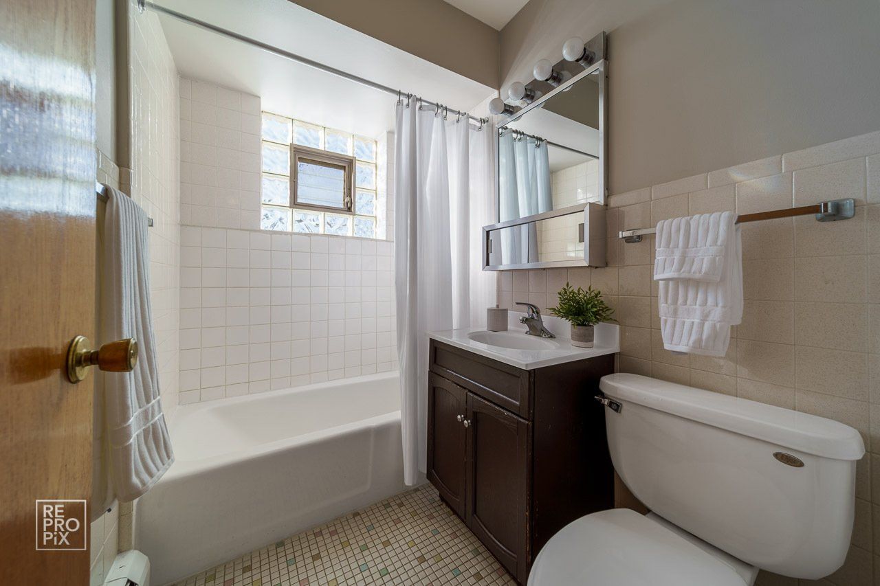 bathroom with shower and tub