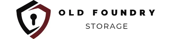 Logo for Old Foundry Storage featuring a shield icon with a keyhole design and the company name in black text.