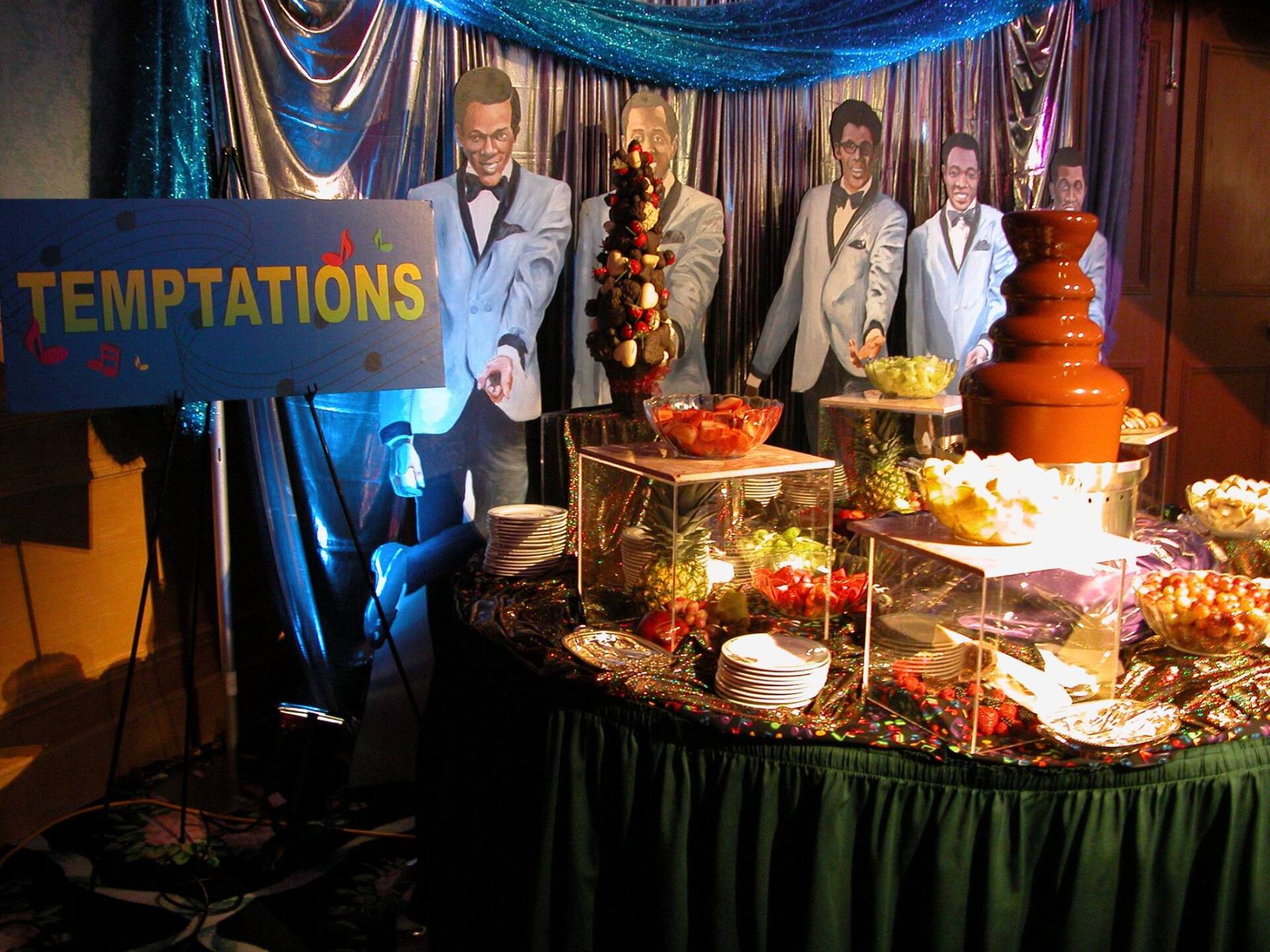 A table with a sign that says temptations on it