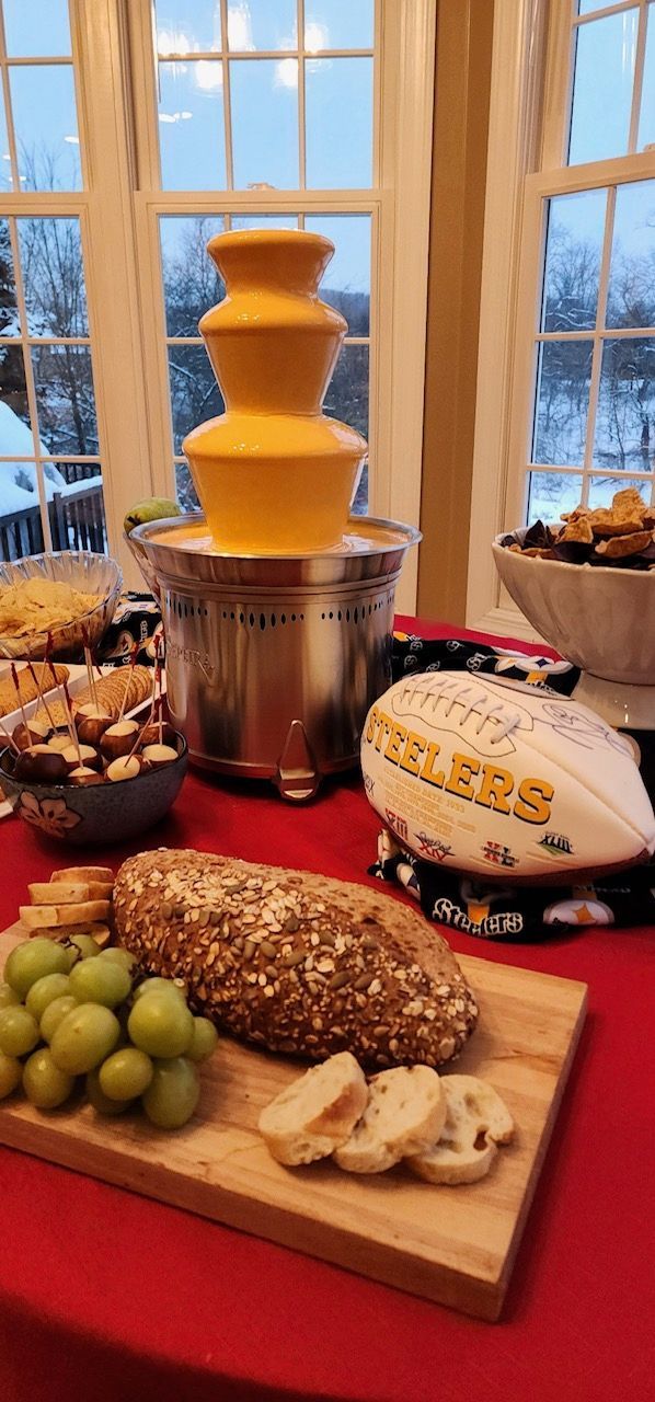 A table topped with food and a chocolate fountain.