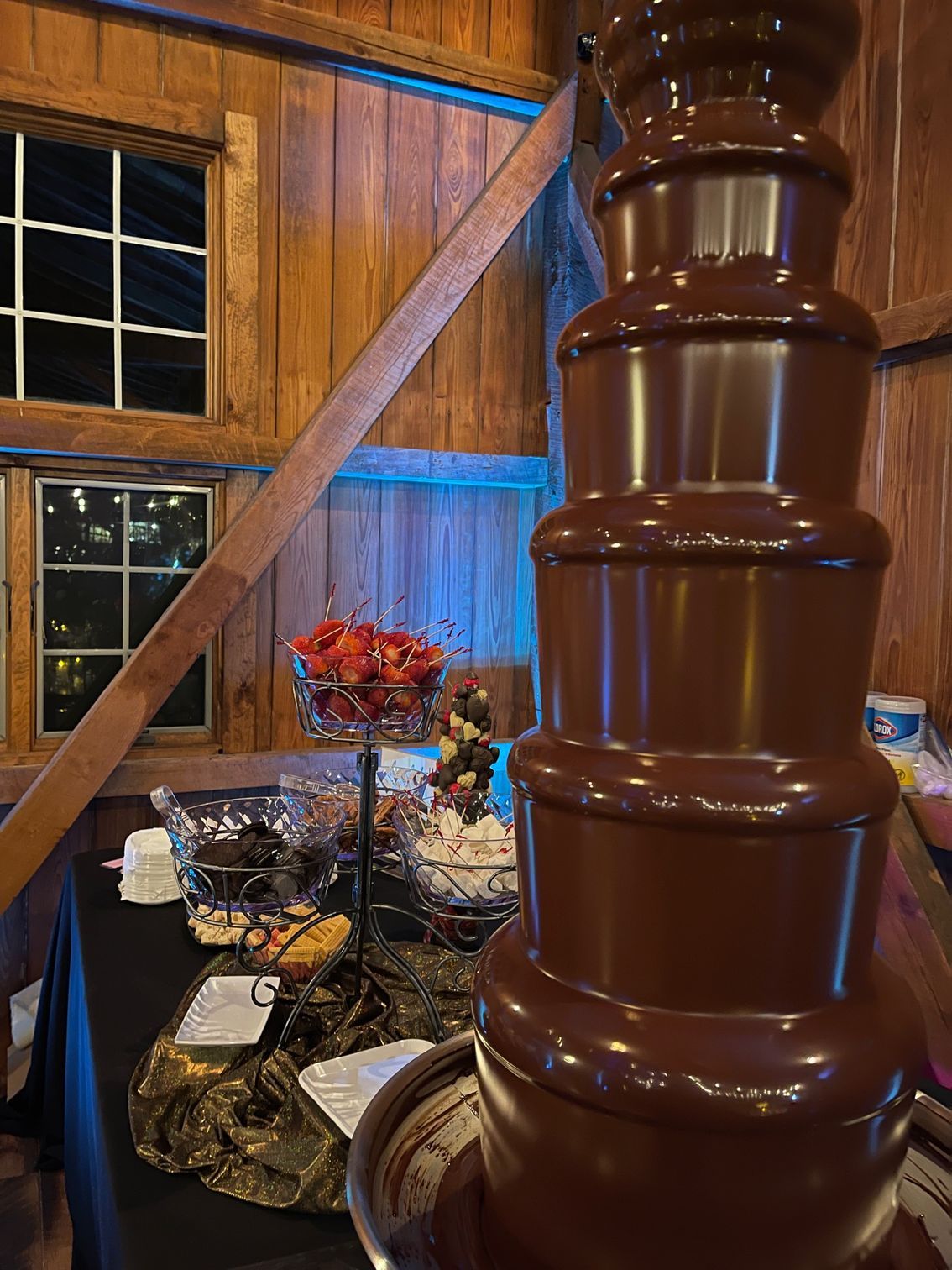 A large chocolate fountain is sitting on top of a table.