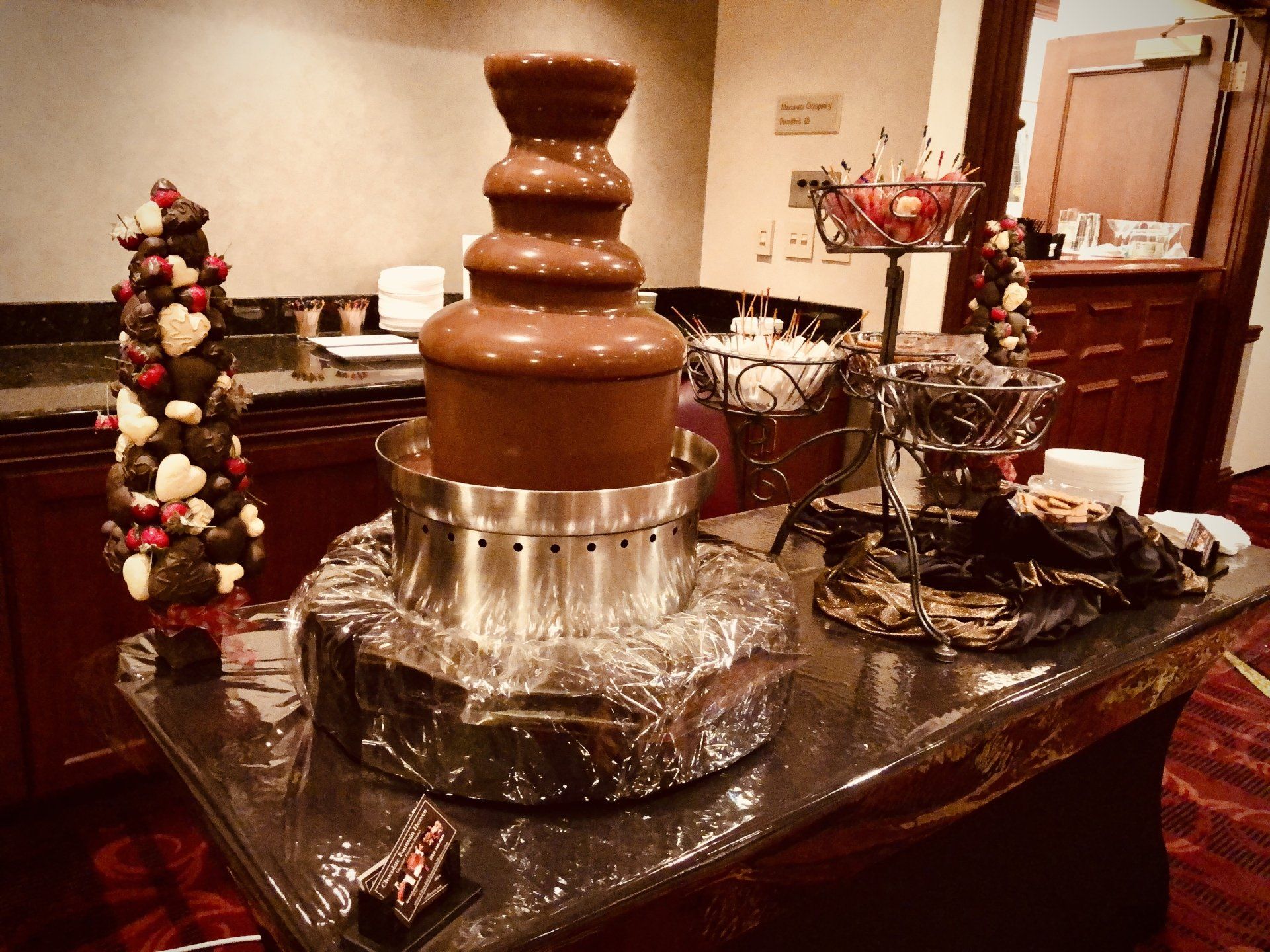 A chocolate fountain is sitting on top of a table