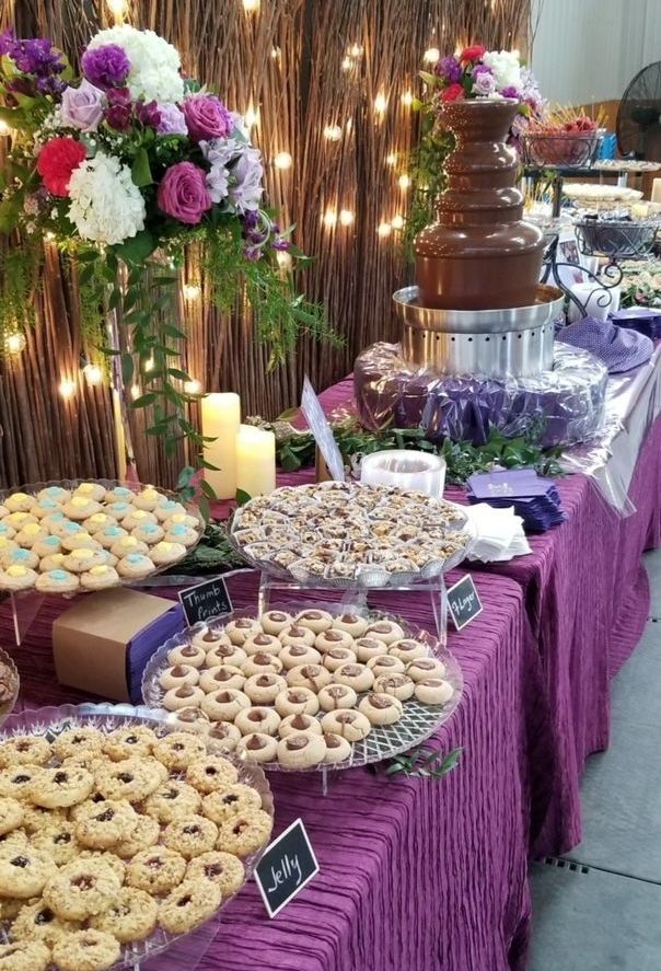 A table topped with plates of cookies and a chocolate fountain.