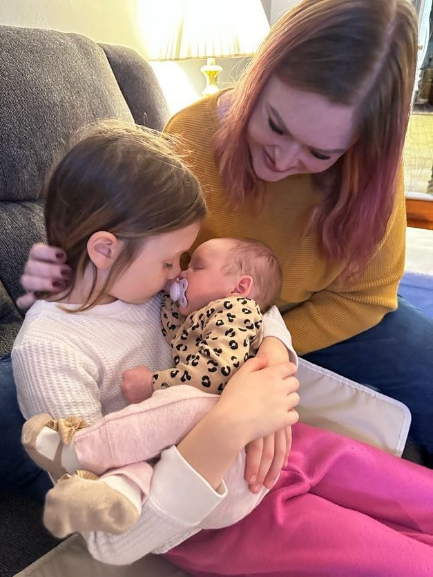 image of therapist laura ott and her family postpartum